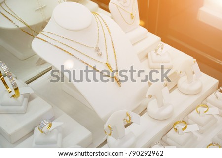 Jewelry diamond shop with rings and necklaces luxury retail store window display showcase