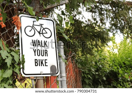 Walk your bike sign