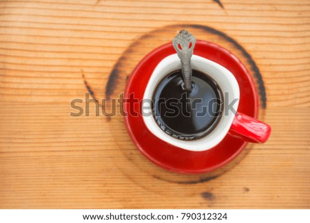 red coffee cup on wood table,Top view