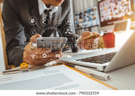 close up of hand using tablet ,laptop, and holding smartphone online banking payment communication network,internet wireless application development sync app,virtual graphic  icon diagram 