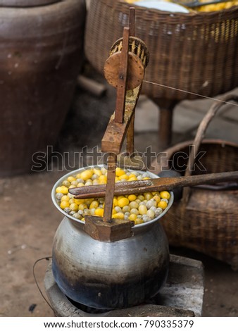 Boiling silk cocoons to extract silk form cocoons
