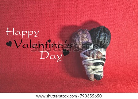 Purple and black dolls,2 puppets. has a black heart. Use double ropes.On red cloth. concept: happy valentine's day, Love each other forever.