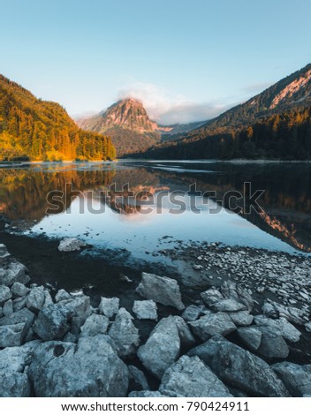 Incredible image of the azure pond Obersee at twilight. Location famous place Nafels, Mt. Brunnelistock, Swiss alps, Europe. Picture of wilderness area, hiking concept. Discover the beauty of earth.