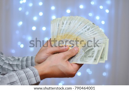 Man holding pile of money. Serbian dinar paper currency, 2000 dinars value. Business and success concept