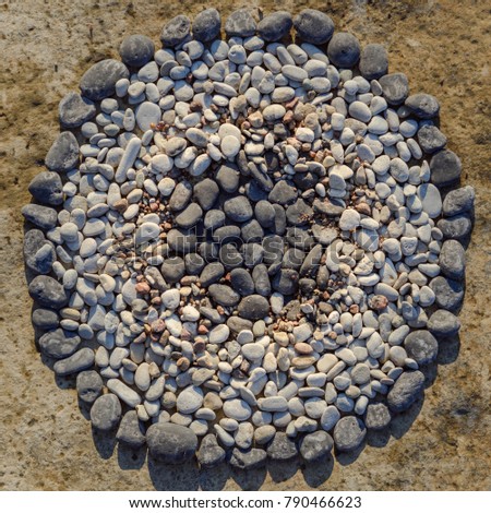 Black and white pebbles in circle. Zen meditation of rock garden concept