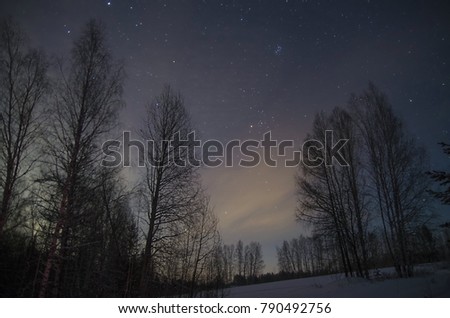 Night astronomical landscape in winter