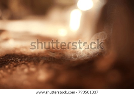 autumn blurred background with bokeh, landscape in autumn october park along alley with trees, autumn background for design and text, background with fallen yellow leaves concept of autumn pictures