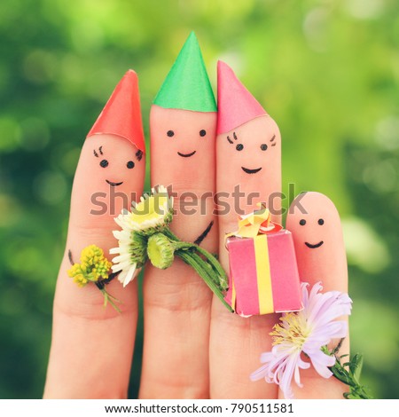     Fingers art of family celebrates birthday. Toned image. 