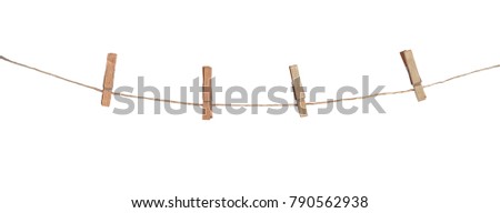 Four wooden clothespins on a rope, isolated on white background Royalty-Free Stock Photo #790562938