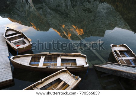 beautiful mountain lake in the alps, on the lake boats, Italy