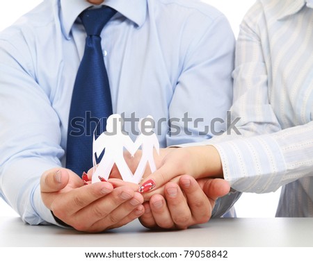 Business people's hands holding paper people, closeup