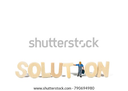 Selective focus of Miniature Worker People, with Wood text on white background.