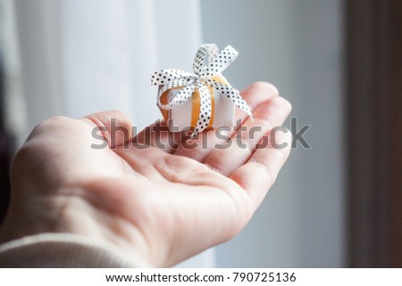 Small gift in hand