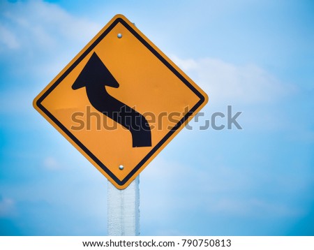 Curves ahead traffic sign on blue sky, Close up