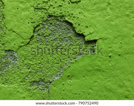 Natural background. Wall with a shabby and peeling paint and plaster. Contrast and volume,green .Renovation Concept. Blank Peeled Surface