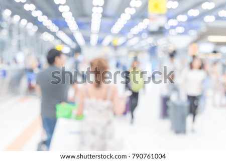 Abstract blur terminal airport for background, which including of passenger in airport terminal and passenger are waiting for check in to travel in Terminal Departure.