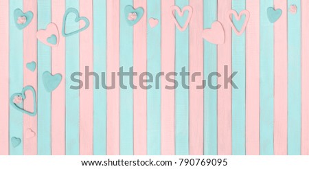 Valentine's Day and Love background or greeting card template, flat lay, hearts on on soft pink and light mint pastel colored  wooden backdrop