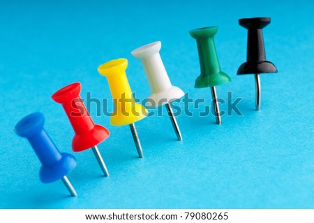 Office pins on the paper