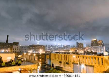 Midtown Manhattan skyline on a cloudy night, New York City.