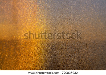 Abstract background with sparkling gold lights and with motion blur. Festive texture