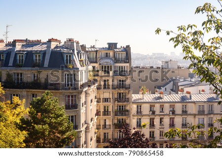 Paris, France. View on French Parisian apartments  and  flats with typcial balconies. Cityscape panorama from park in front of Sacre Coeur in Paris, France.