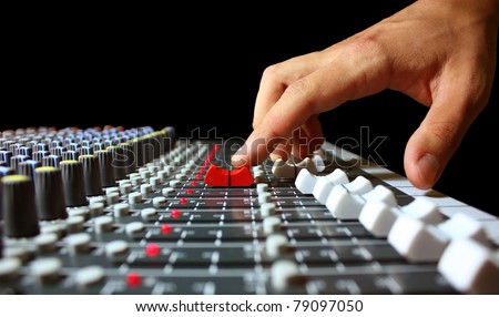 Hand on a mixer, operating the leader Royalty-Free Stock Photo #79097050