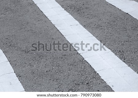 Street line larking made from white color thermoplastic material. 