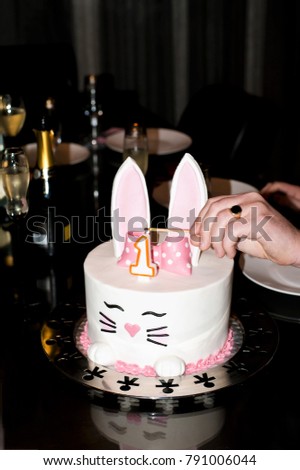 pink cake with bunny for children's birthday