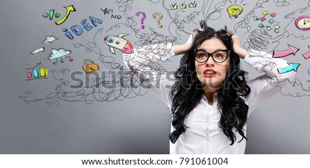 Unhappy woman with many thoughts on a gray background Royalty-Free Stock Photo #791061004
