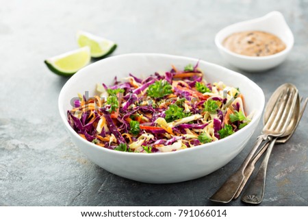 Asian cole slaw with sesame and peanut butter dressing Royalty-Free Stock Photo #791066014