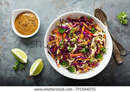 Asian cole slaw with sesame and peanut butter dressing Royalty-Free Stock Photo #791066035