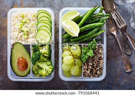 Vegan green meal prep containers with quinoa, rice, avocado and vegetables Royalty-Free Stock Photo #791068441