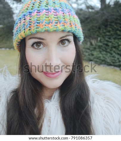 Woman on a cold day outdoors wearing knit hat