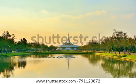 Beautiful public parkland Suan Luang R.9 in Bangkok Thailand,beautiful sunset   of reflection pavilion and tree