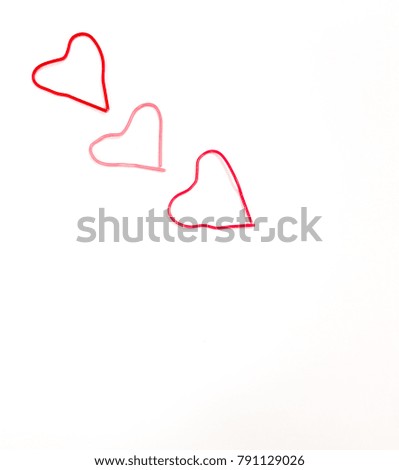 Valentine day concept - soft focus top view heart-shaped paper clip on white background. 