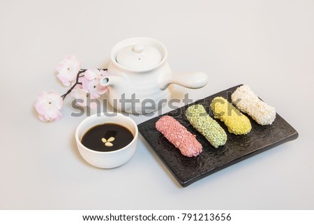 Korea traditional cookies on the white board. cherry blossom, teapot, Korea traditional tea Royalty-Free Stock Photo #791213656