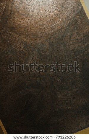 Textured surface of a sharp wall. Brown, dark, beige, red. Designer background. Artistic plaster. Rastered digital fit. Realistic photo.