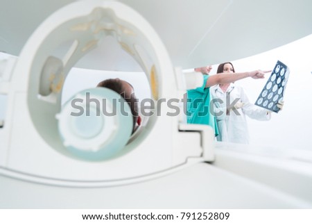 Team of doctors looking at radiology picture, concept