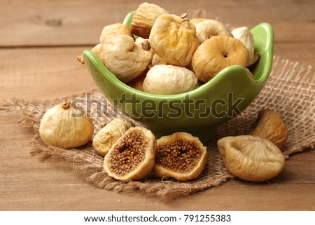 Figs on old wooden background.