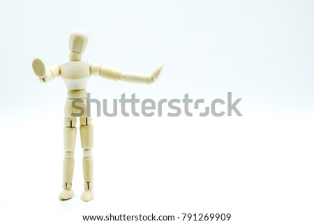 Wooden puppet.Wooden figure posed as if leaning on something. Room for text or objects to be inserted.