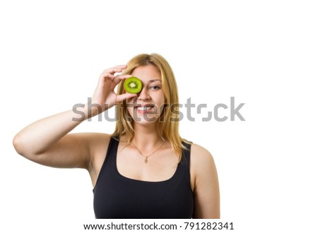 Young cheerful european woman with blond hair and kiwi eyes. Healthy eating, raw food concept