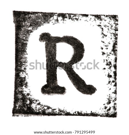 Capital letter 'R' printed black ink stamp isolated on white background