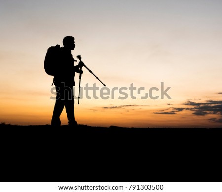 Silhouette of travel photographer in a hills station 