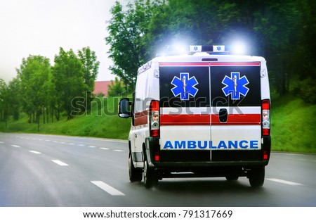 Ambulance van on highway Royalty-Free Stock Photo #791317669