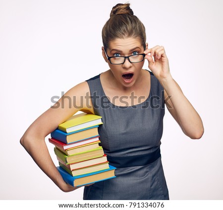 Business woman holding books shouting and screaming. Isolated portrait.