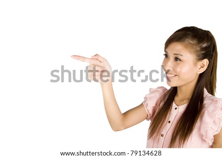 Young smiling Asian female pointing. Isolated on white background.