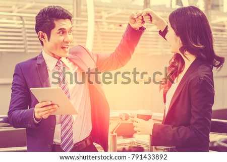 Business Partners Giving Fist Bump to Greeting Start up new project or complete mission successful deal together with strong teamwork.Business partnership start up concept.Merger, acquisition concepts