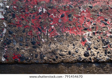 background old concrete texture with gravel,red line on the road edge,top view, close up
