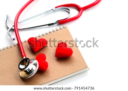 Flat lay, top view of red medical stethoscope, notebook and red hearts isolated on white background using for healthcare, medical, treatment, education and Valentine concept.
