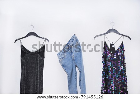 sequins clothes with jeans on hanging-gray background

